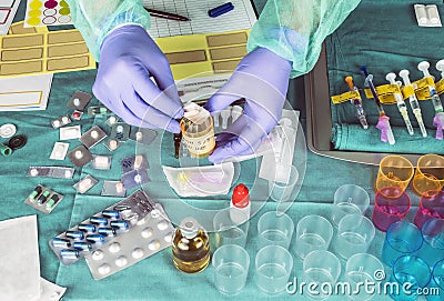 Nurse preparing hospital medication, placing dose medicine in glass monodose, conceptual image Stock Photo