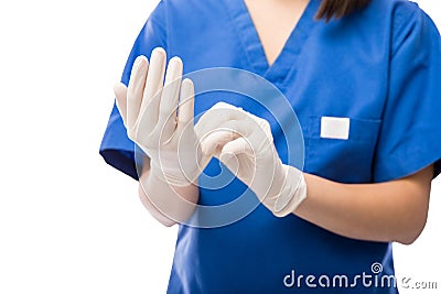 Nurse putting on some gloves Stock Photo