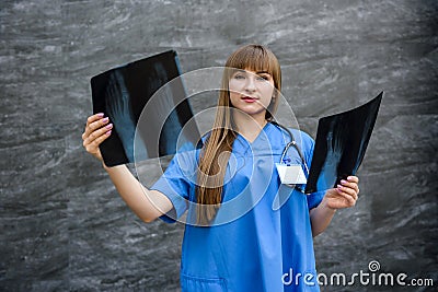 Nurse student examines X-ray of foot. Medical concept Stock Photo