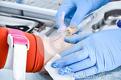 Nurse takes blood from a vein for analysis. Stock Photo