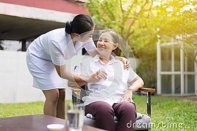 Nurse taking care of her patient mature asian elderly woman,Happy and smiling,Senior healthy concept Stock Photo