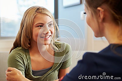 Nurse Treating Teenage Girl Suffering With Depression Stock Photo