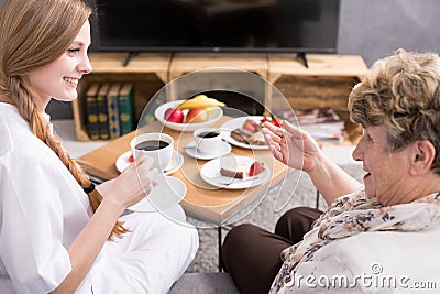 Nurse visiting patient at home Stock Photo