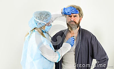 Nurse woman examine patient. bio hazard. Having Cold Virus Caught Flu Disease. Listen Heart Beating and Measuring Stock Photo