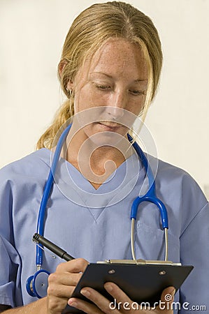 Nurse writing prescription Stock Photo