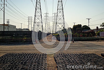 Nurseries seem to always find a home under the high voltage transmission lines. Stock Photo