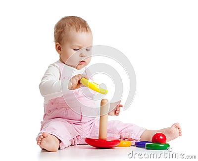 Nursery baby playing with toy. Isolated on white Stock Photo