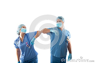 Nurses in scrubs elbow bump instead of shaking hands during COVID-19 pandemic Stock Photo