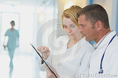 Nursing staff consulting clipboard Stock Photo