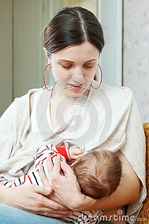 Nursing three-month baby Stock Photo