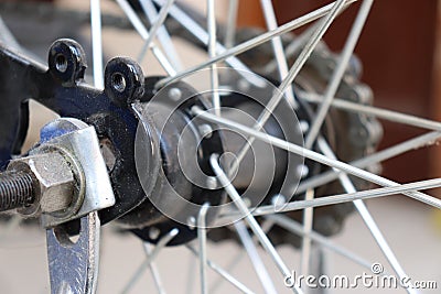 Nut on axis of rear bicycle wheel Stock Photo