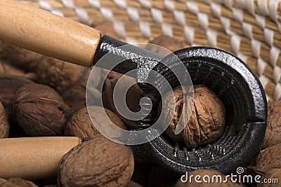 Nut cracker in a basket with wallnuts Stock Photo