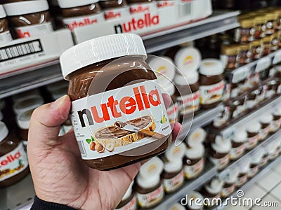 Nutella jars of hazelnut cream in french supermaket shelf. Nutella is a brand of products made in Italy by Ferrero Editorial Stock Photo