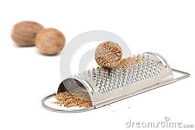 Nutmeg with grinder Stock Photo