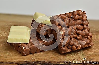 Chocolate crispies sweets and white chocolate set one next to the other Stock Photo
