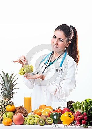 Nutrition doctor holding a grape fruits Stock Photo