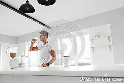 Nutrition Supplements. Man Drinking Protein Shake Before Workout Stock Photo