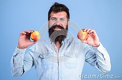Nutritional choice. Man with beard hipster hold apple fruit in hand. Nutrition facts and health benefits. Apples popular Stock Photo