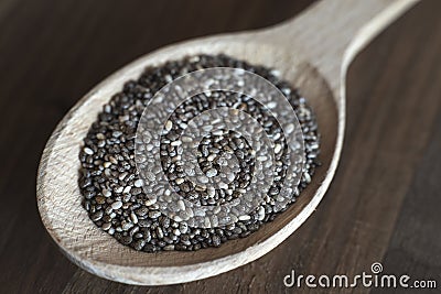 Nutritious chia seeds on a wooden spoon Stock Photo