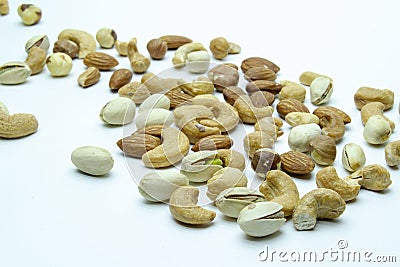 nuts almonds cashew hazelnuts scattered on white background Stock Photo