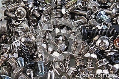 Nuts and bolts. tweak bolts,twist texture pattern as background. Alloy silver abstract art artsy background Stock Photo