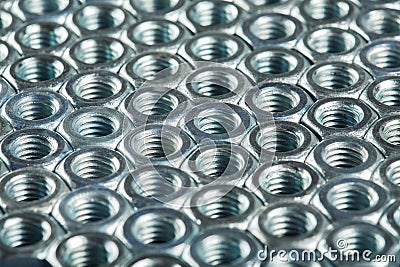 Nuts, bolts, screws on a dark concrete background Stock Photo