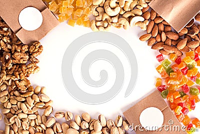 Nuts and dried fruits in the craft package. Photo for the catalog. Place for logo, your text. Stock Photo