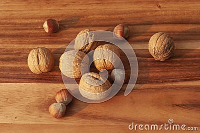 Nuts hazelnuts and walnut on wooden table Stock Photo