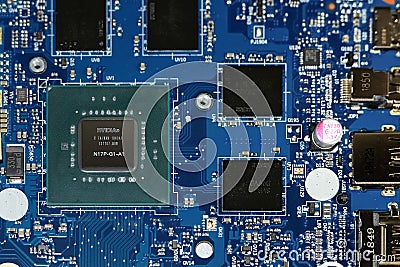 Nvidia GPU Graphics chip on a laptop motherboard. Top down. Close up. Editorial Stock Photo