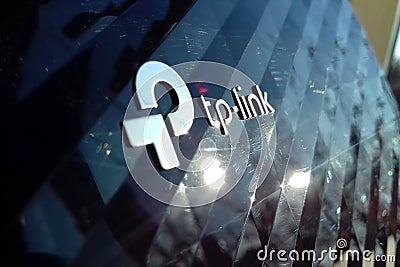 New tp-link logo on wireless router modem tp link Archer C20 AC750 reflective surface Editorial Stock Photo