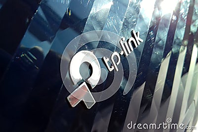 New tp-link logo on wireless router modem tp link Archer C20 AC750 reflective surface Editorial Stock Photo