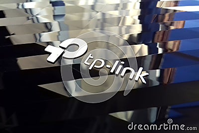 New tp-link logo on wireless router modem tp link Archer C20 AC750 reflective surface Editorial Stock Photo