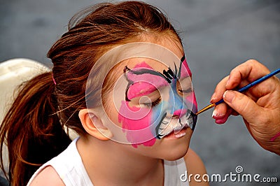 NYC: Artists Face Painting a Little Girl Editorial Stock Photo