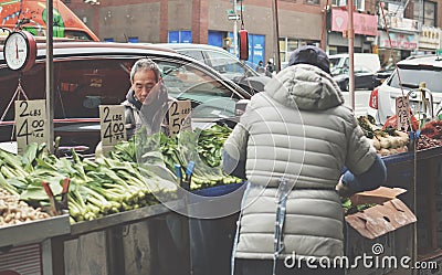 NYC Chinatown Fruit Vendor Stand Chinese People Selling Street Fruits and Vegetable Editorial Stock Photo