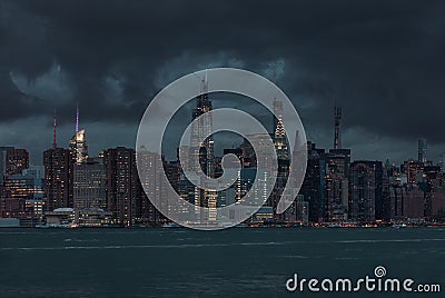 NYC Cityscape with Stormy Cloudy Blue Sky in Background Stock Photo