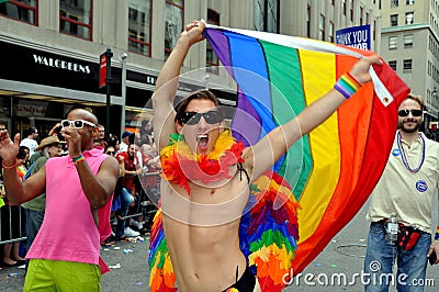 NYC: Exuberant Man with Rainbow Flag Editorial Stock Photo