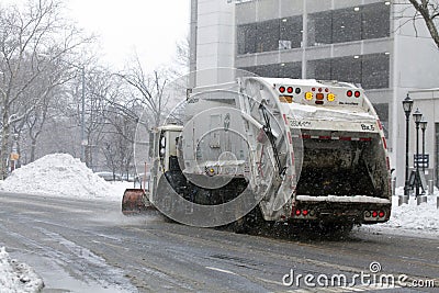NYC Sanitation trucks plowing snow in the Bronx Editorial Stock Photo
