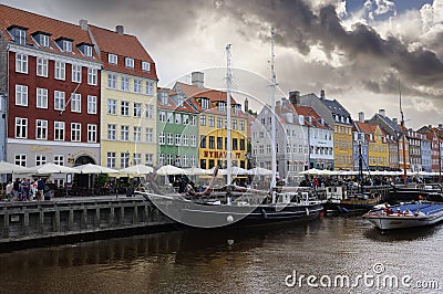 Nyhavn Harbour under a partly cloudy sky Editorial Stock Photo