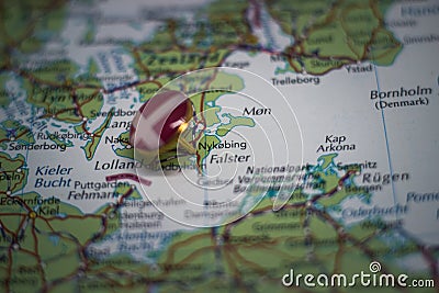 Nykobing Falster pinned on a map with the flag of Denmark Stock Photo