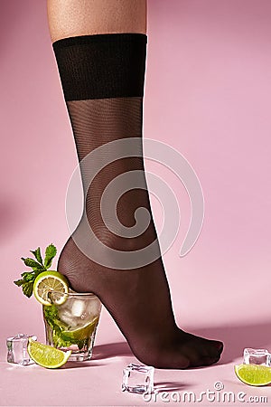 Nylons, stay-up, tights, hosiery, hose, pantyhose socks summer collection on pink background as a heel creative a glass of Stock Photo