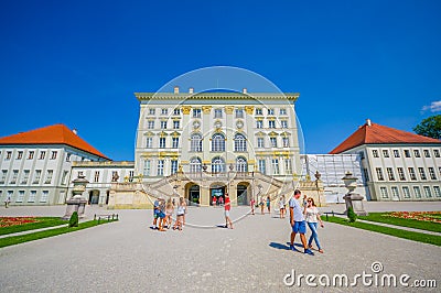 Nymphenburg, Germany - July 30, 2015: Beautiful palace building as seen from outside front view, royal architecture with golden de Editorial Stock Photo