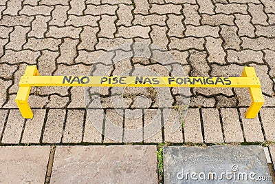 NÃ£o pise nas formigas Don`t step on the ants sign at the Khadro Ling Buddhist Temple in Tres Coroas, Brazil Stock Photo