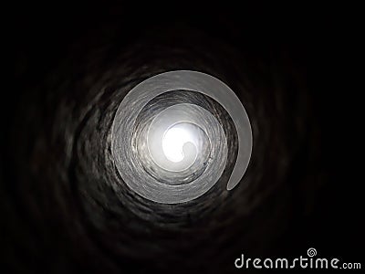 Black tunnel with light in the end, background. Dark toward light. Abstract of light at the end tunnel. Stock Photo