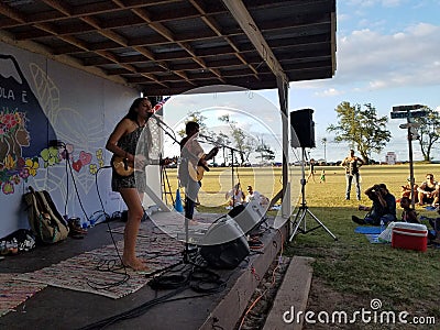 Taimane and band playing at Hawaii Polo Club Editorial Stock Photo