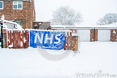 OAKHAM/RUTLAND, ENGLAND- 24 JANUARY 2021: `NHS we thank you` banner ouside a house in Oakham, Rutland, England Editorial Stock Photo