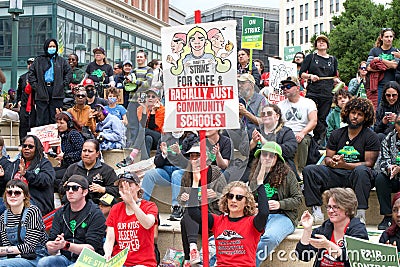 Teachers and supporters holding signs protesting at a Teacher Strike Rally in Oakland, CA Editorial Stock Photo