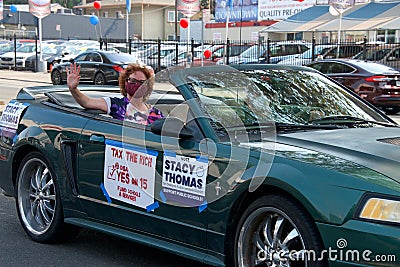 Unidentified protestor in cars and bicycle caravan promoting prop 15 Editorial Stock Photo