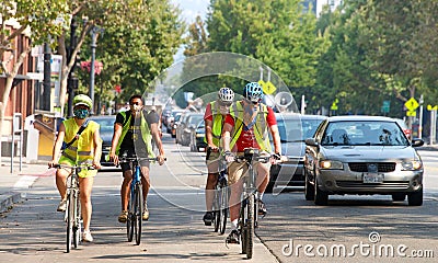 Unidentified protestor in cars and bicycle caravan promoting prop 15 Editorial Stock Photo