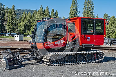 Oakridge, Oregon, USA - May 14, 2023: A Pisten Bully snow groomer parked at the Union Pacific rail yard Editorial Stock Photo