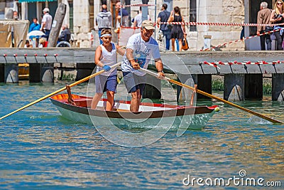 Oarsmen in the Venice Vogalonga regatta, Italy. Editorial Stock Photo
